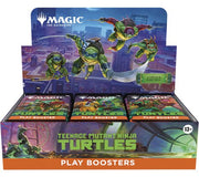 Magic the Gathering Universes Beyond - Teenage Mutant Ninja Turtles - Booster Box (english). Display box for Teenage Mutant Ninja Turtles-themed Magic: The Gathering play boosters with cityscape background.
