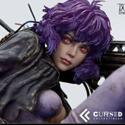 Close-up of Motoko Kusanagi Ghost in the Shell collectible statue featuring realistic facial details, glowing red eyes and purple cyberpunk hair.
