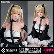 Marie Rose (Dead or Alive) Realistic Silicone 1:1 Replica Cosplay Model Doll (AXB Doll). Two views of a life-size 1:1 scale silicone human replica of a blonde anime character with black hair accessories, wearing a black and white outfit, shown on a dark gray background with product text overlays. This is not a sex doll (but can be upgaded).
