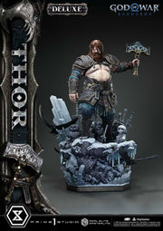 Thor figure from God of War Ragnarok with weapons and rocky base on gray background. God of War: Ragnarök Real Elite Masterline Series Statue 1/3 Thor Deluxe Version 105 cm
