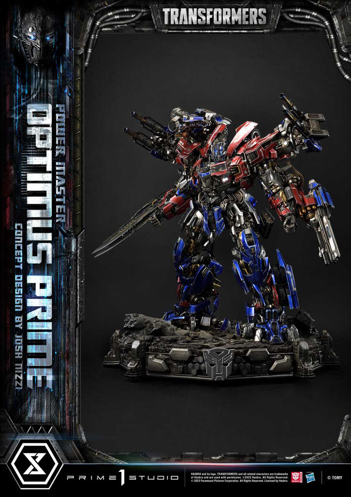 Transformers Optimus Prime figure with branding and studio name on a dark background. Transformers Museum Masterline Statue Powermaster Optimus Prime Concept by Josh Nizzi Ultimate Version 99 cm